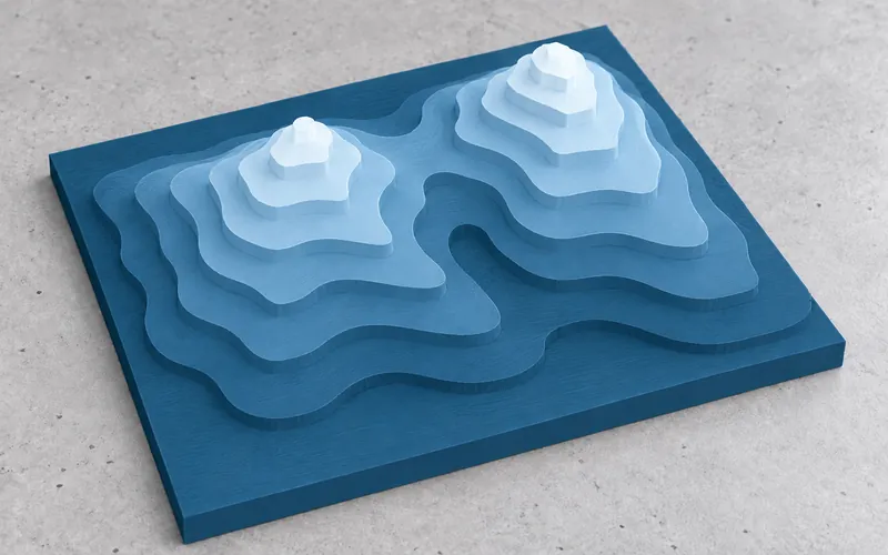 Blue mountain terrain model with icy white peaks and stepped contour terraces on a rectangular base.