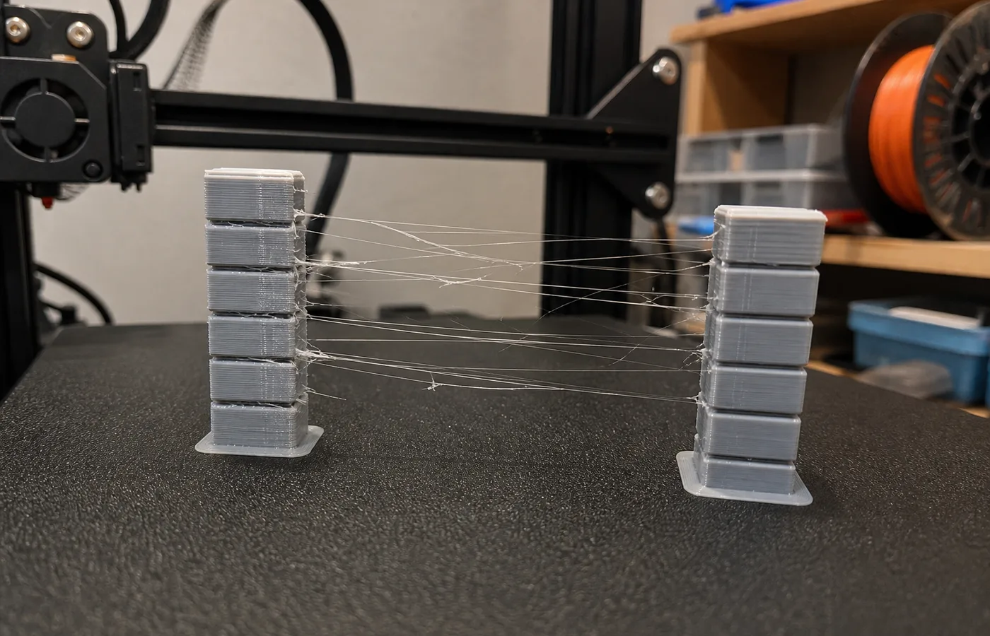 3D print stringing with thin hairs of filament between parts
